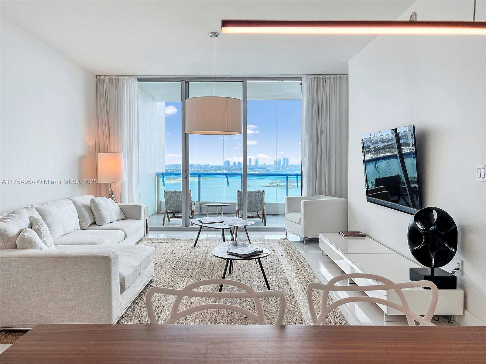 Breathtaking Bay views from its spacious balcony This 3 bed 3 baths unit features floor to ceiling windows allowing for abundant natural light and a seamless indoor outdoor living experience ...