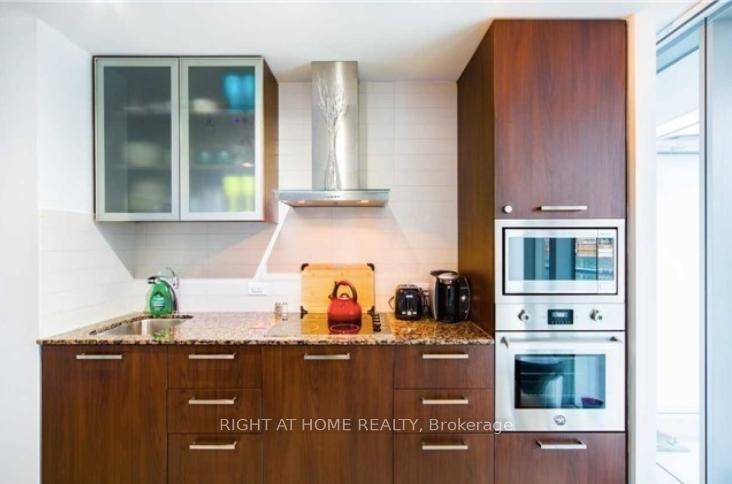 LUXURY FULLY FURNISHED amp ; EQUIPPED Corner Suite Facing Quiet Side Of Building Looking Onto Canopy.