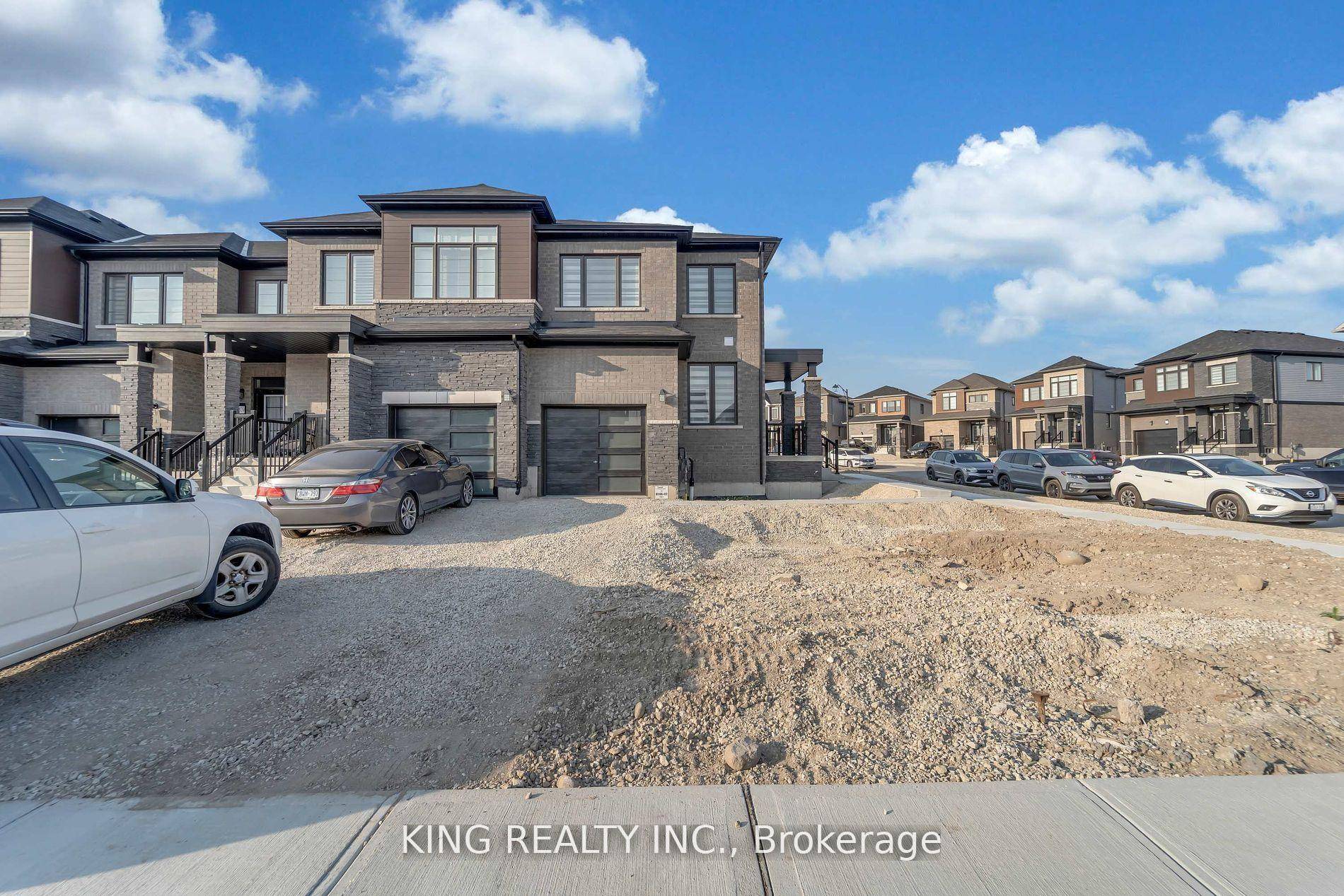 Bright and spacious end unit townhouse on a rare 40 ft corner lot, offering the feel of a detached home with natural light from all sides.