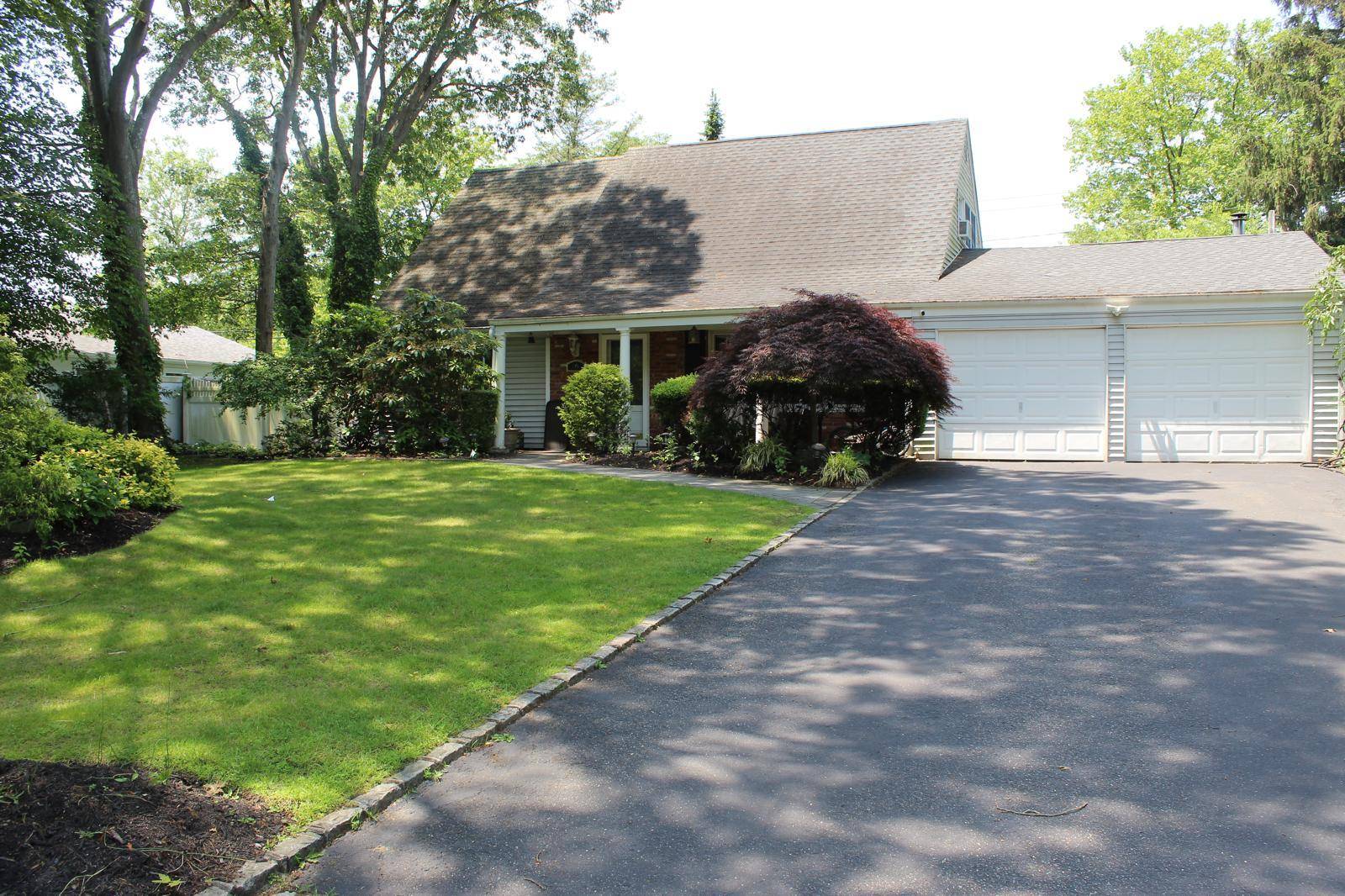 Welcome to 16 Barnwell Lane, a beautifully updated expanded Cape nestled in the heart of Stony Brook s desirable Strathmore section.