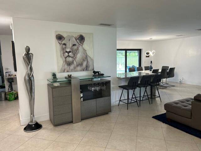 Come see this stunning, updated 4 bedroom, 3 bathroom corner lot home in the heart of Davie.