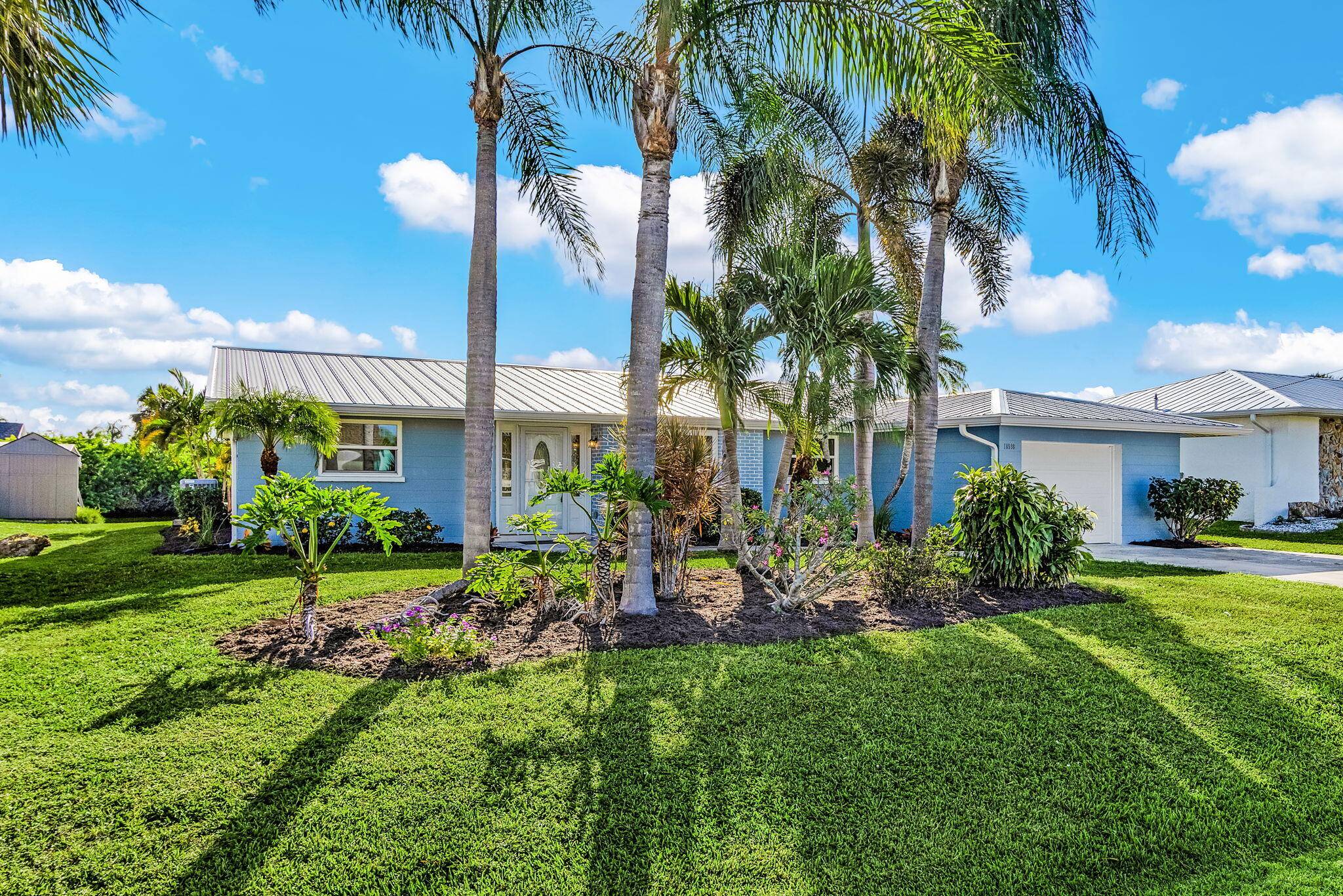 Beautifully updated 3BR 2BA waterfront home in Port Charlotte with 1 car garage and no HOA !