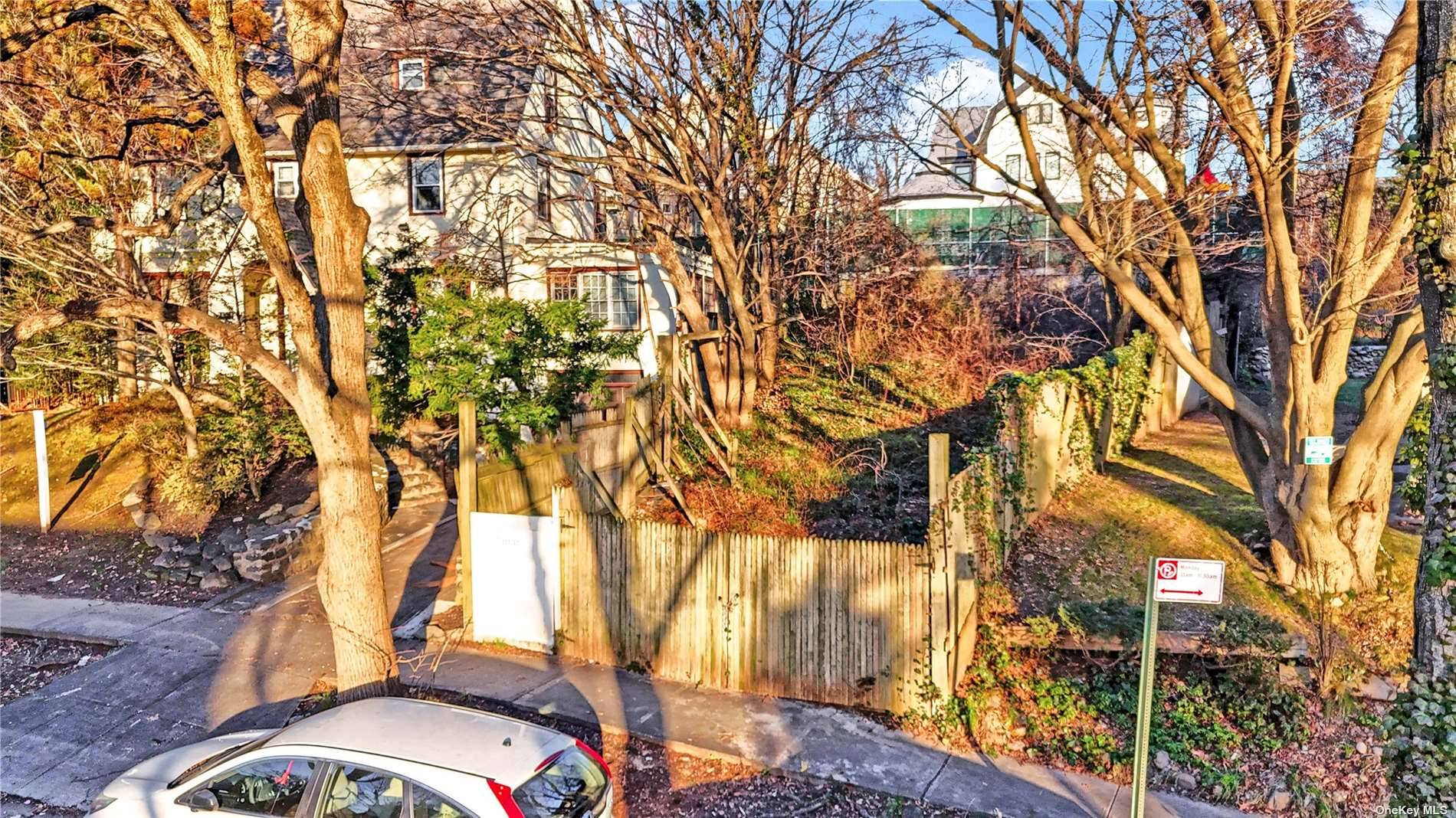 Vacant lot available for sale on quiet residential block in Kew Gardens, Queens.