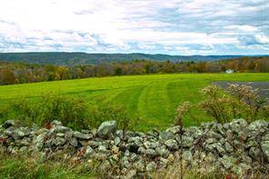 This country barn style home at High Meadow Farm sits atop Skiff Mountain with a jaw dropping views and hidden privacy !