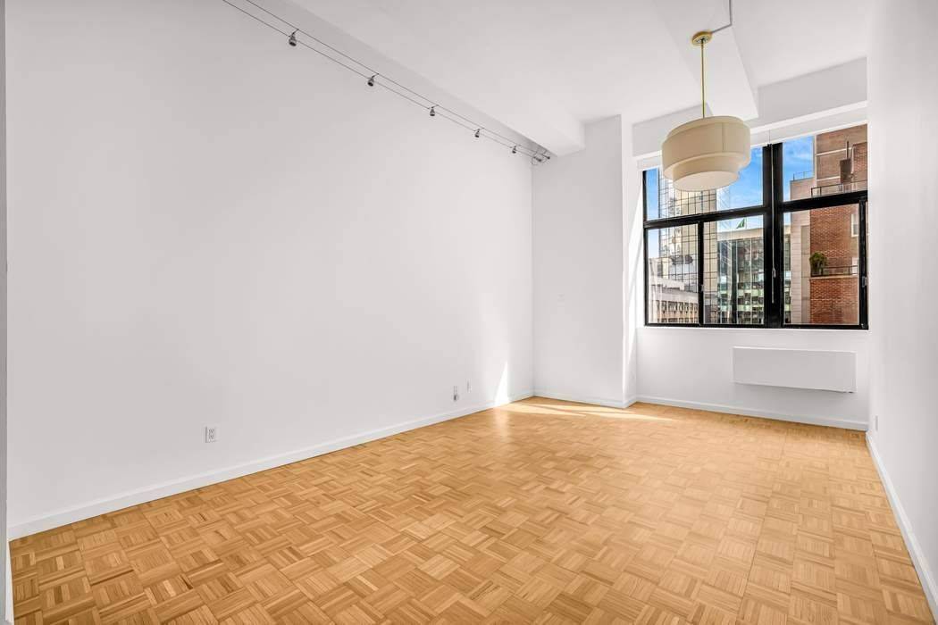 Step into this extremely unique one bedroom plus standing sleep loft home office residence in the heart of Midtown in one of the most coveted pre war loft buildings.