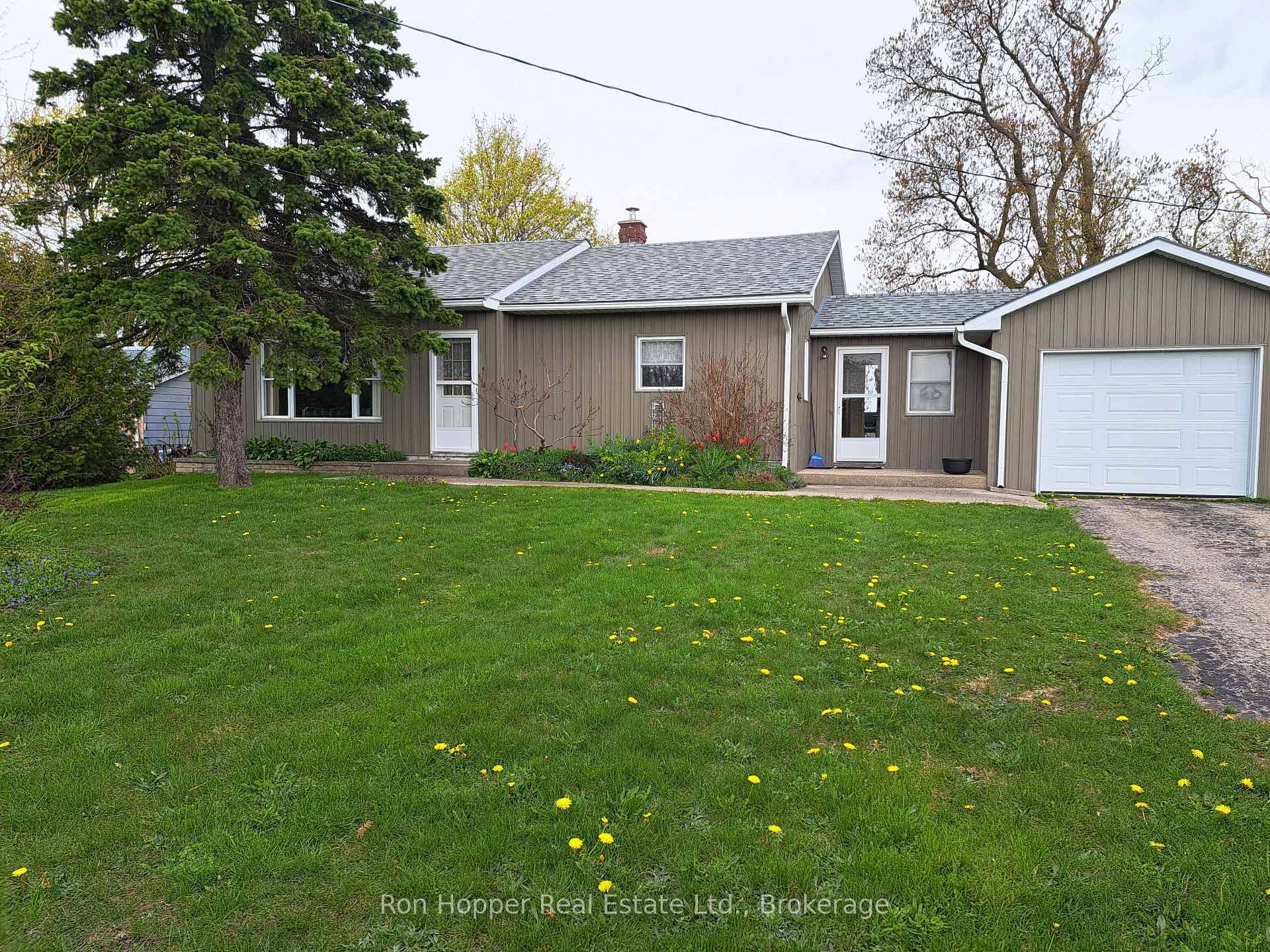 QUAINT AND CHARMING ! This 2 bedroom bungalow offers low maintenance exterior.