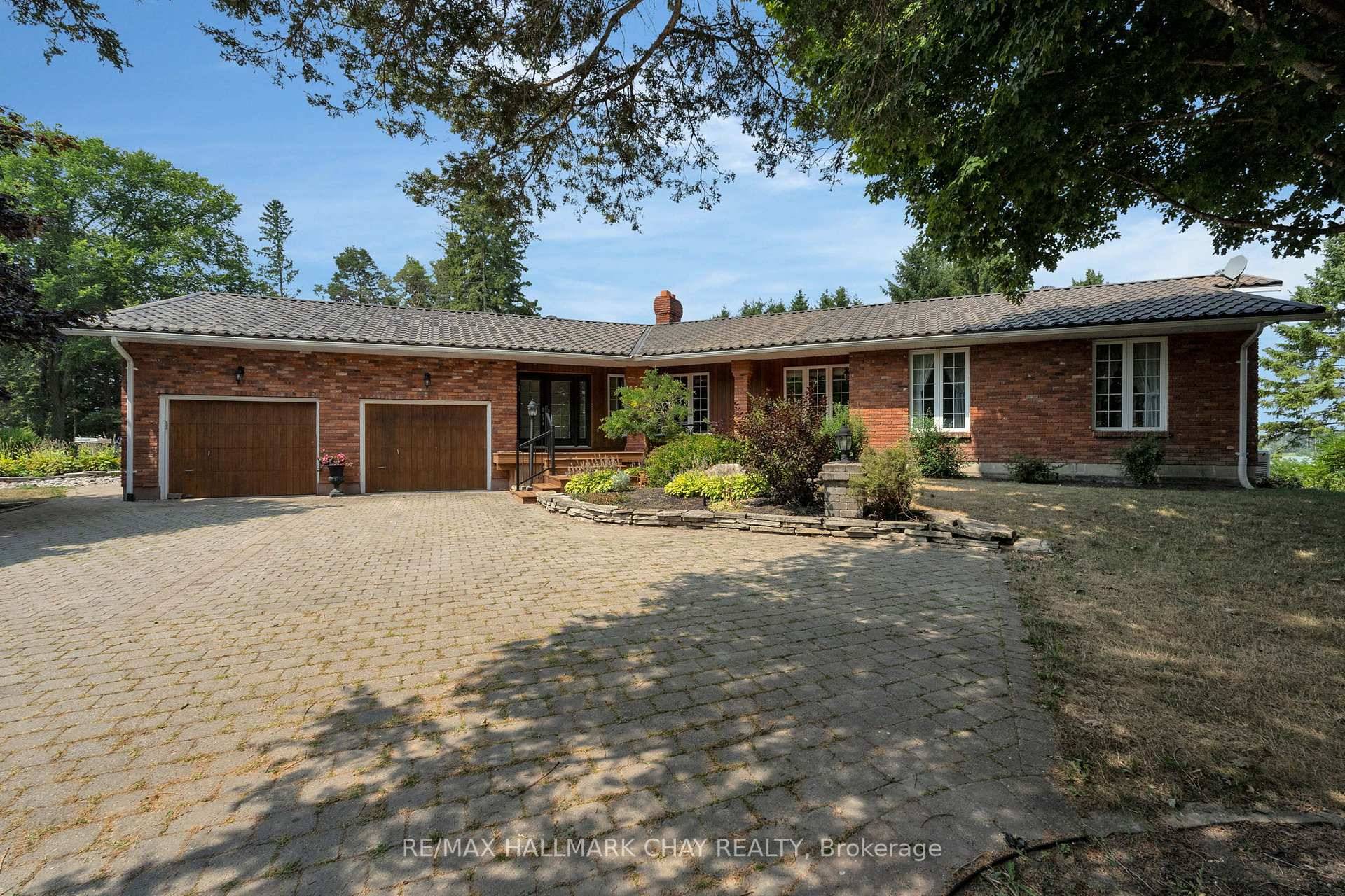 Stunning rental property in a peaceful country setting overlooking Hendrie Lake a true hidden gem just minutes from city amenities !