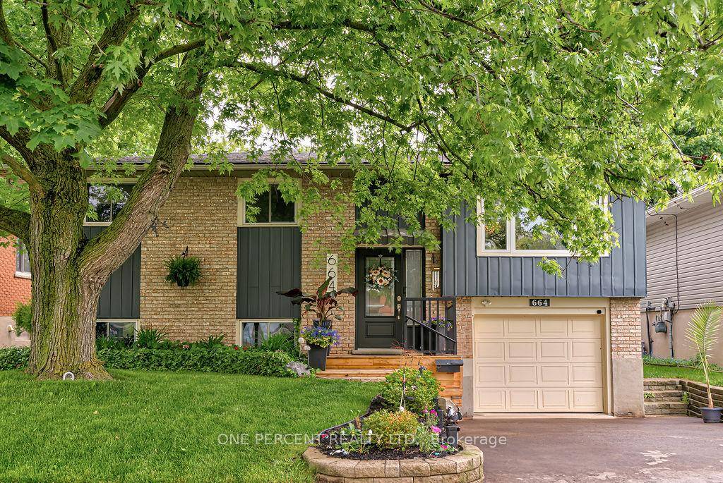 Fabulous 3 bedroom, 2 bath raised bungalow backing directly onto peaceful greenspace in Waterloos high demand Lakeshore Parkdale neighbourhood.
