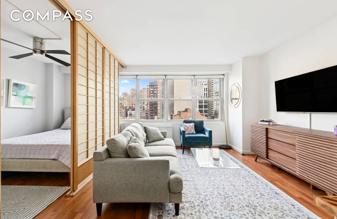 Beautifully renovated high floor studio, thoughtfully converted into a one bedroom, offering open city views in a prime Upper East Side location.
