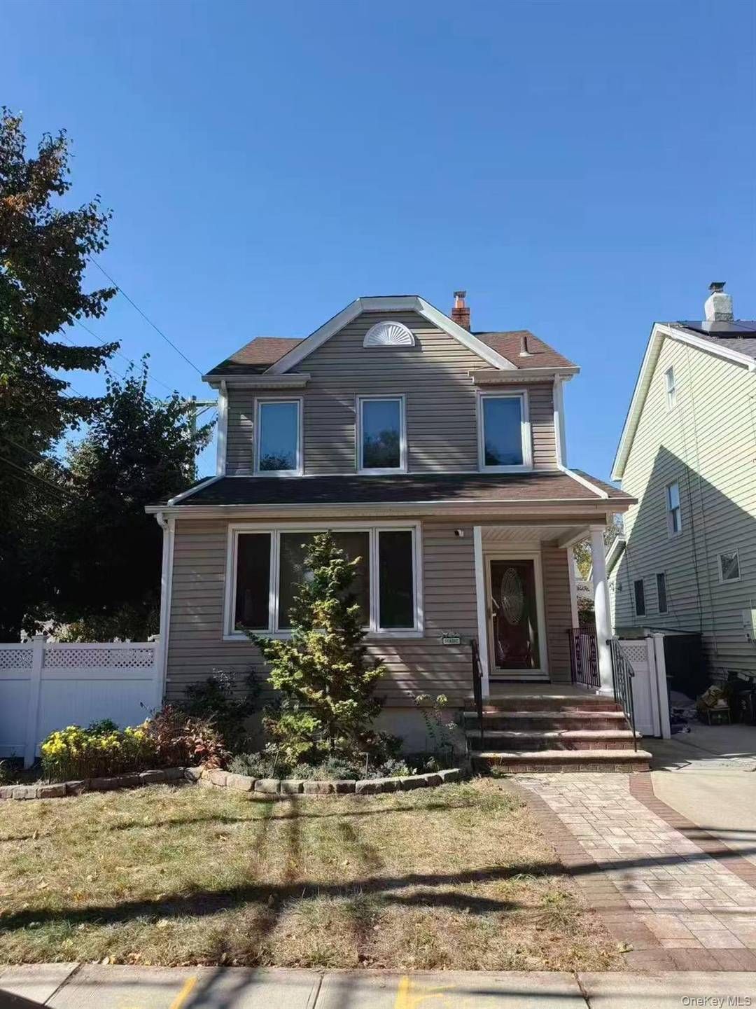 Separate two family corner house in Bellerose, used as a single family.