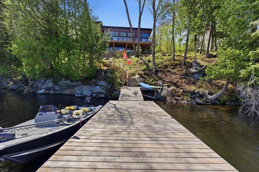 Experience luxury waterfront living on the highly sought after location of Lake Manitouwabing, a large full service lake for all of your boating needs.