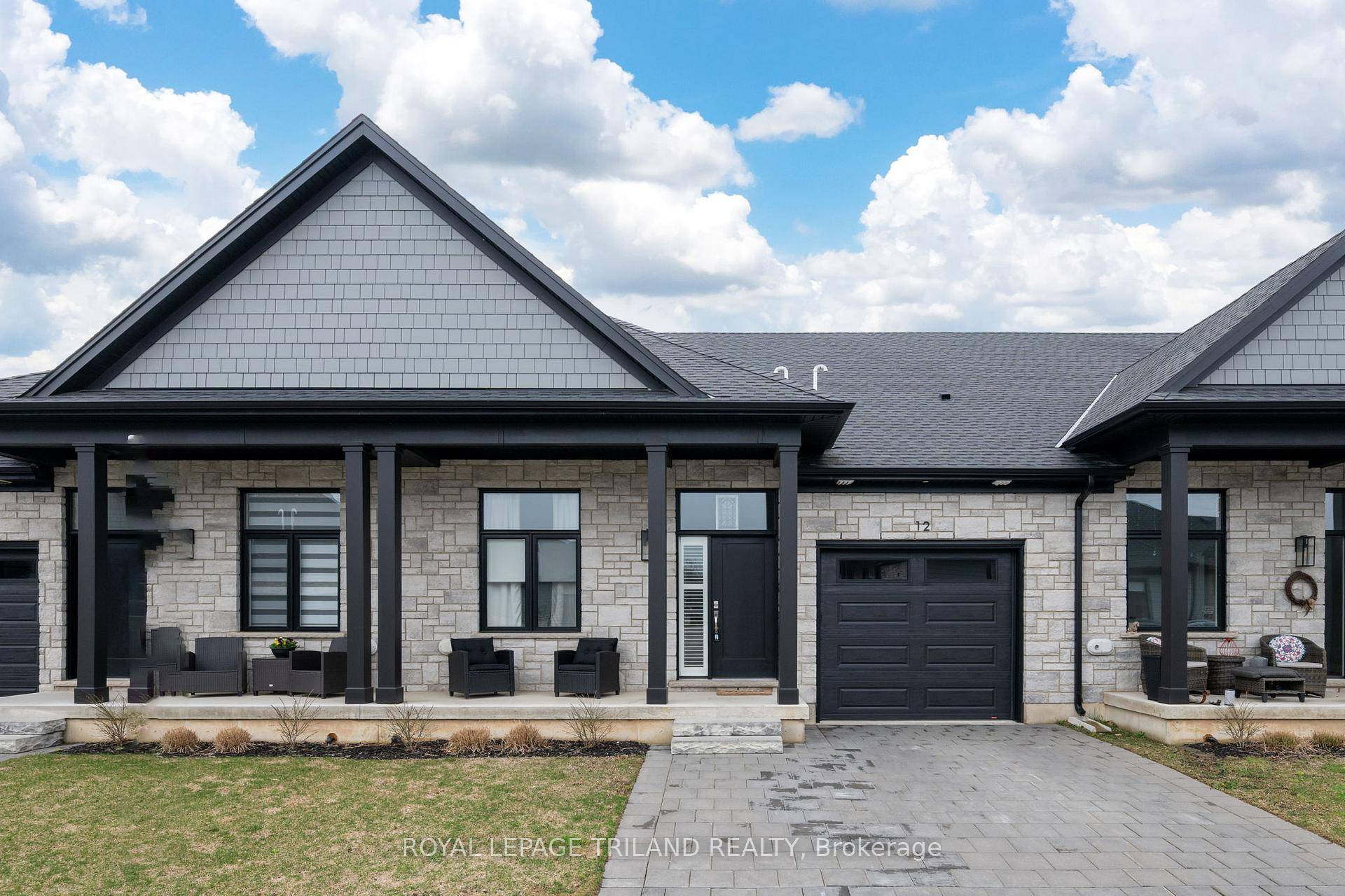 Welcome to Unit 12 at 63 Compass Trail where coastal charm meets effortless living in beautiful Port Stanley !