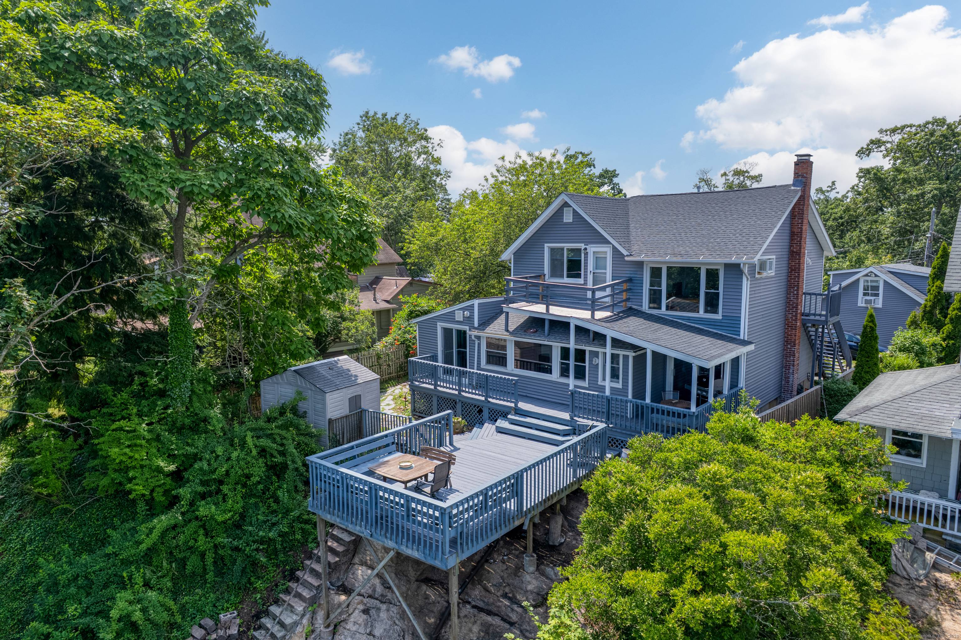Perched high above the shoreline with sweeping views of Long Island Sound, this unique property evokes the charm of Sausalito, CA.