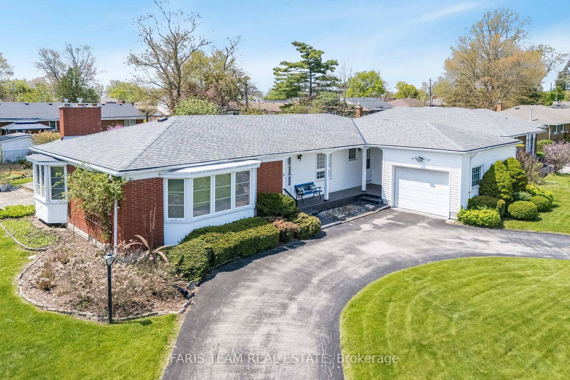 Top 5 Reasons You Will Love This Home 1 Custom built three bedroom bungalow on a double wide lot featuring a bright and inviting living room with a charming front ...