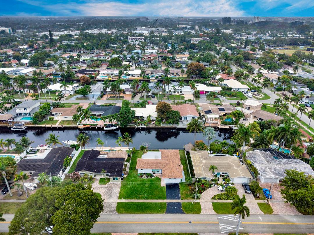 Come home to this large 3 bed 3 bath waterfront home in Coral Ridge Isles.