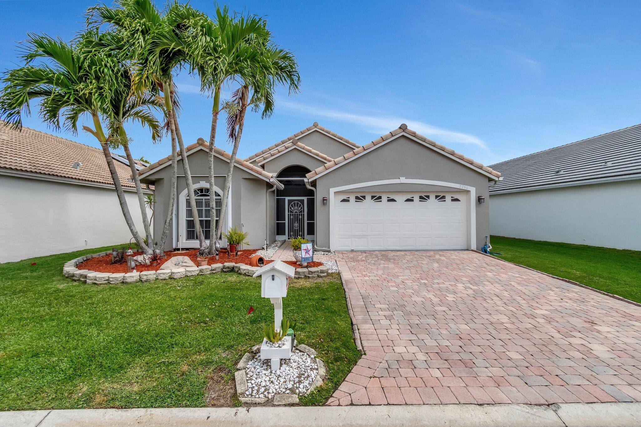 Welcome to 7751 Great Glen Circle, a sphere of modern sophistication in Delray Beach, FL's peaceful, highly sought after area.