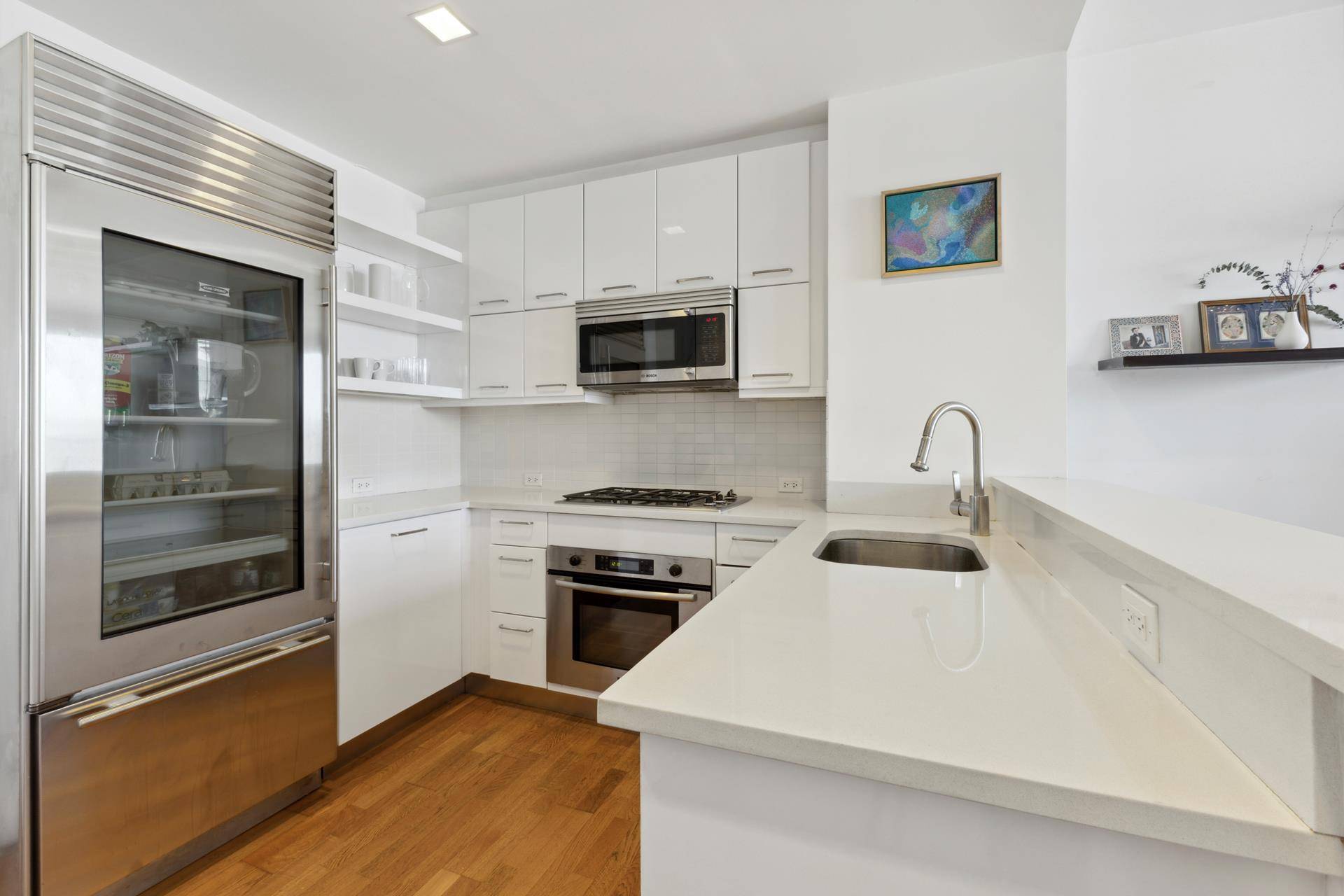 Welcome to this modern north facing two bedroom, two bathroom residence at The Atelier, offering panoramic views of the Hudson River and Billionaires Row.