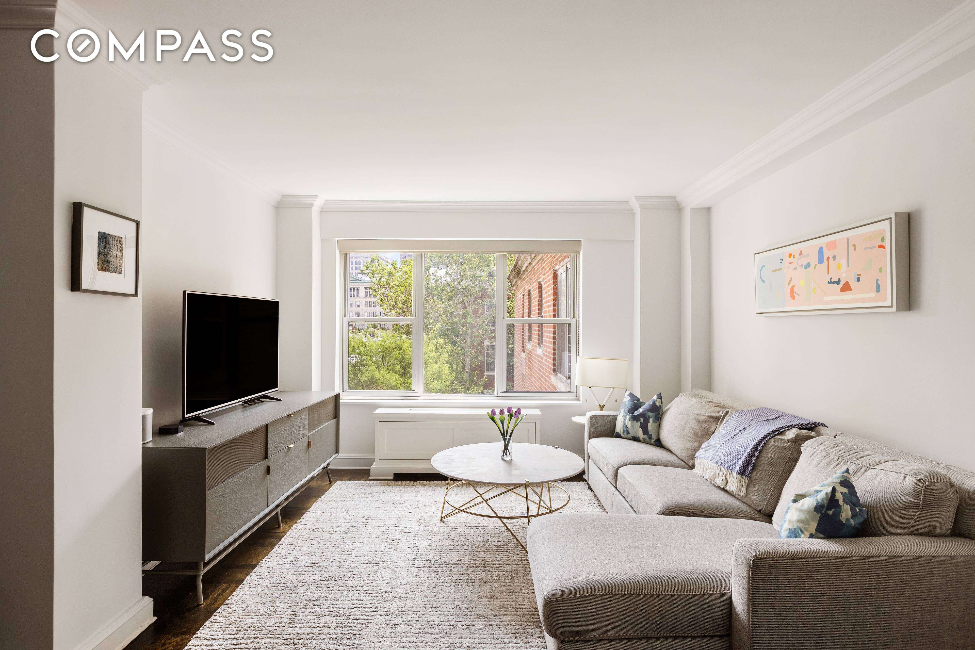 Move right into this beautiful, very sunny, large one bedroom with renovated kitchen and bathroom in an incredible full service, amenity filled building seconds from Washington Square Park.