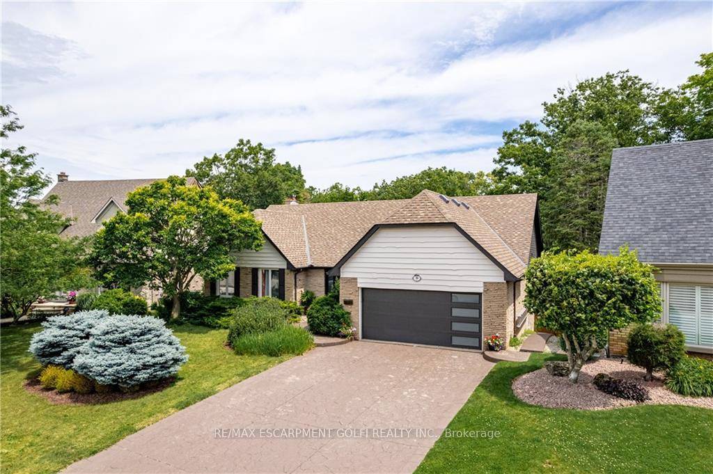 Discover the allure of 39 Hilts Drive, Stoney Creek a truly exceptional bungalow where timeless elegance meets natural tranquility.