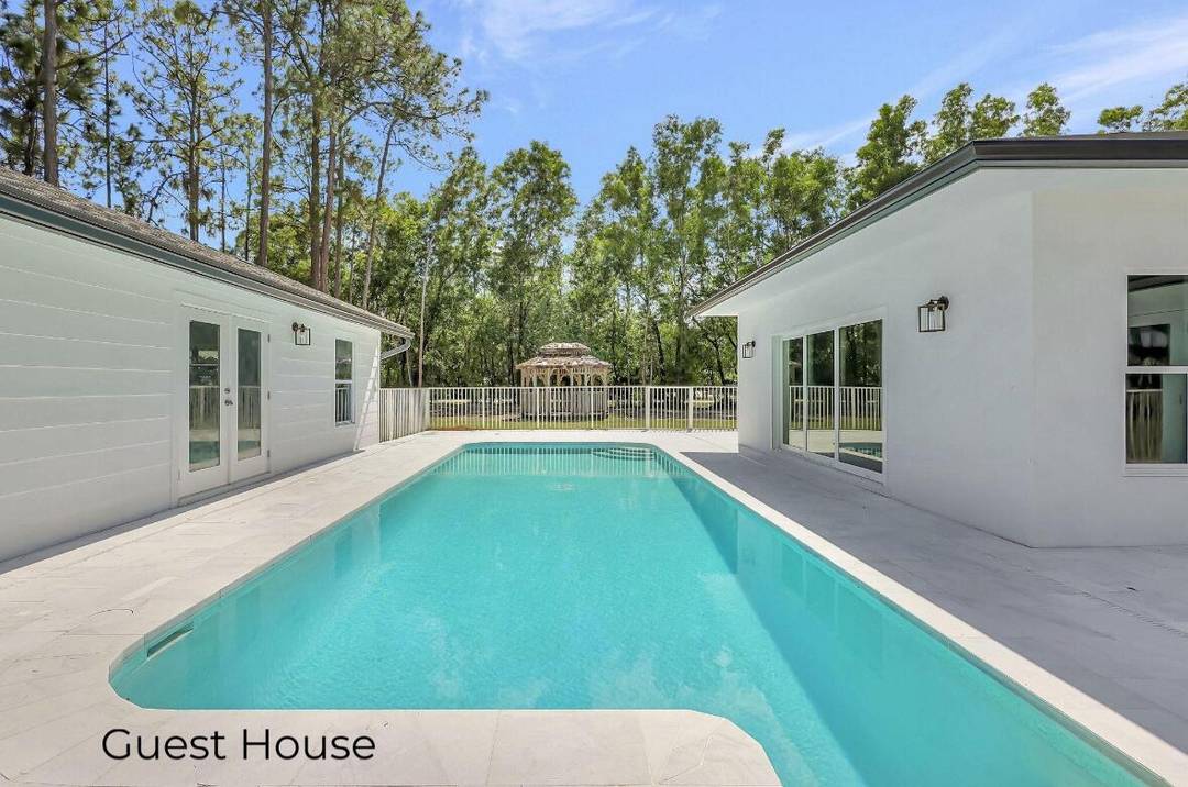 NEWLY REIMAGINED JUPITER FARMS ESTATE Two Fully Renovated Homes on 1.