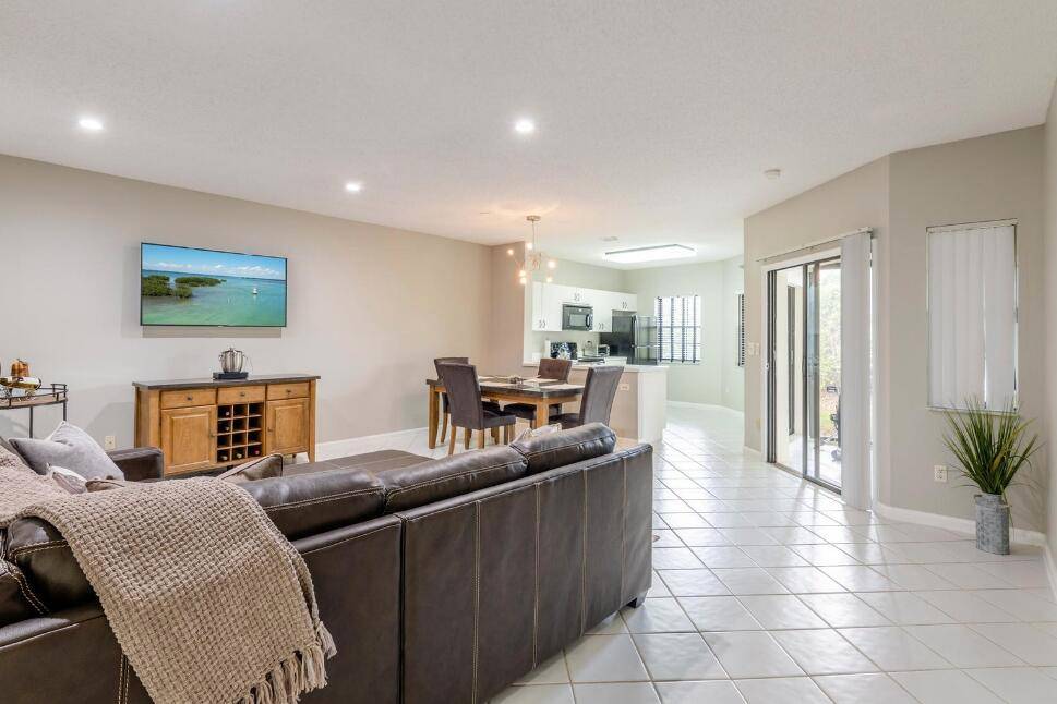 This 2 bedroom 2 bath condo offers the ease of first floor living in the beautiful 24 hour manned gated community of Boca Pointe.