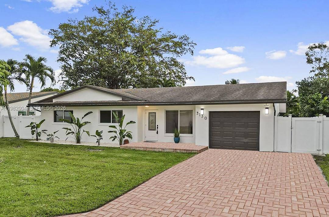 Beautifully updated and spacious 4 2 home with screened in pool on ample waterfront lot.