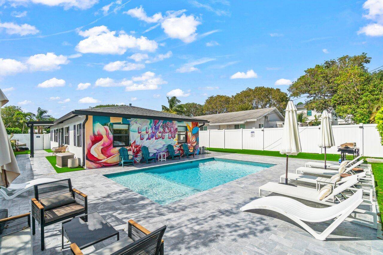 Discover this fully furnished, turn key duplex ideally located just minutes from Pineapple Grove, Atlantic Avenue, and Delray Beach's award winning beaches.