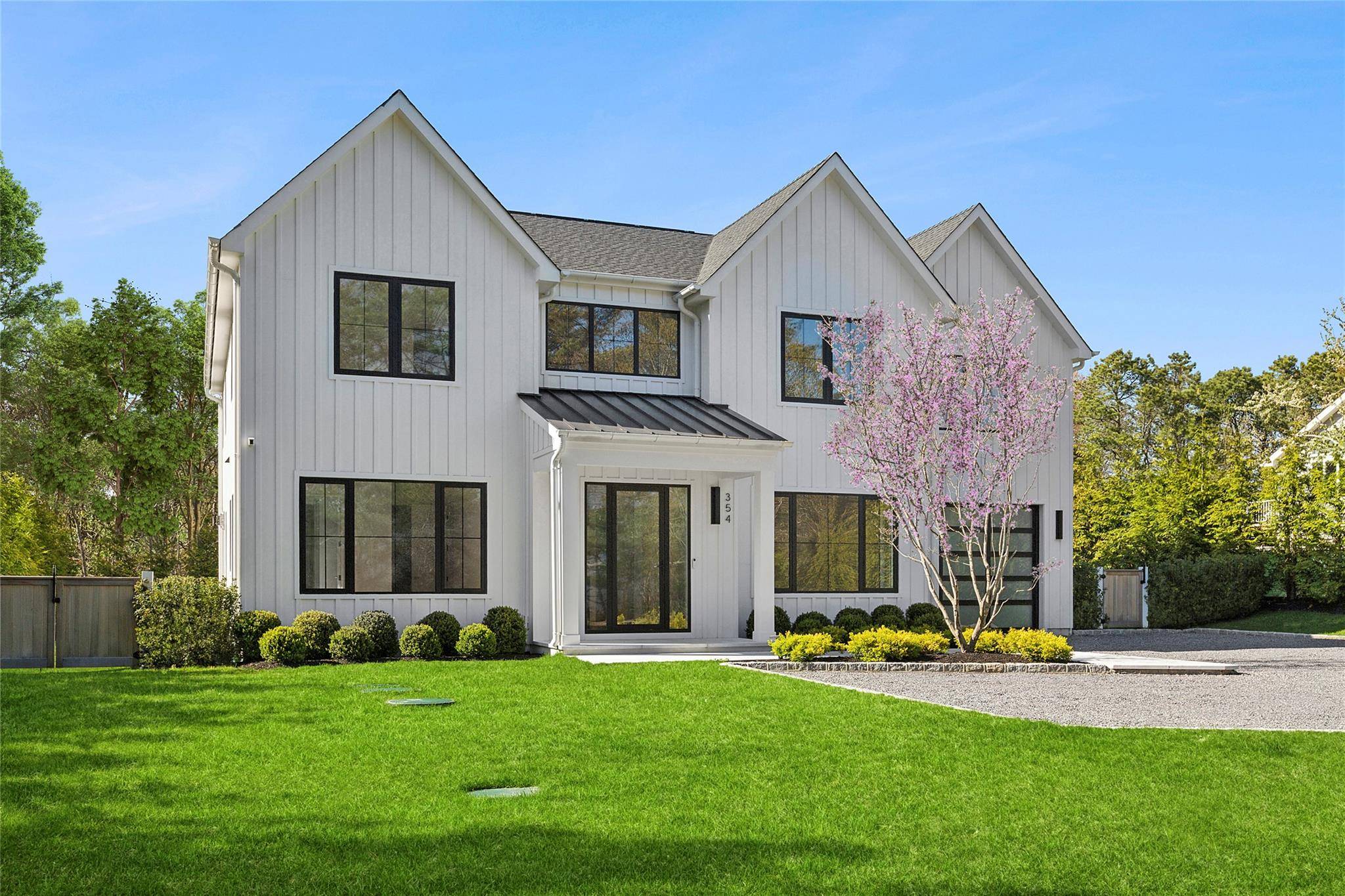Just finished and introducing this magnificently sleek and sunny transitional country home that is abounding with modern flair.