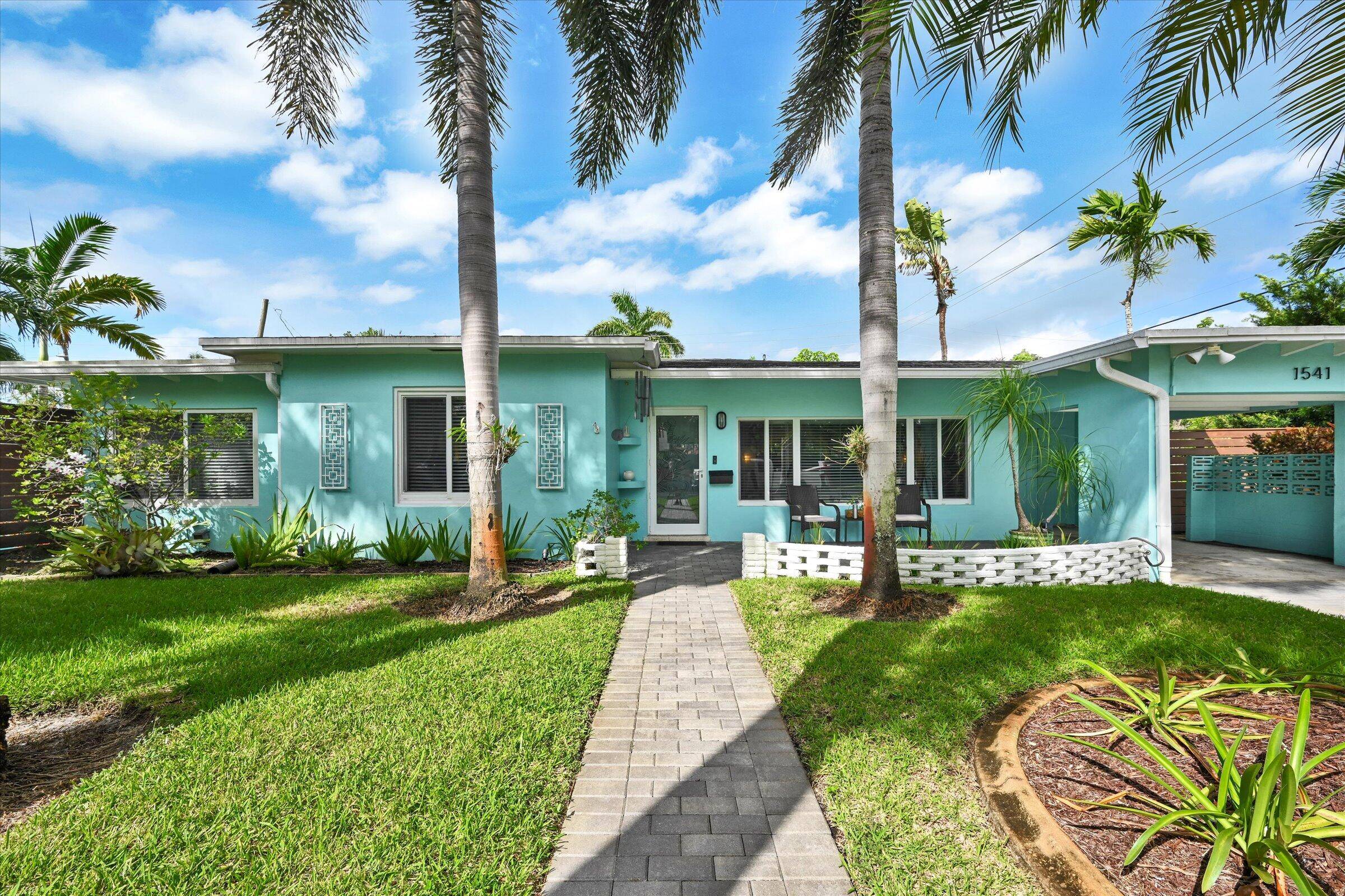 Stunning mid century 3 bedroom 2 bath pool home with amazing curb appeal, set on a coveted corner lot in Poinsettia Heights.