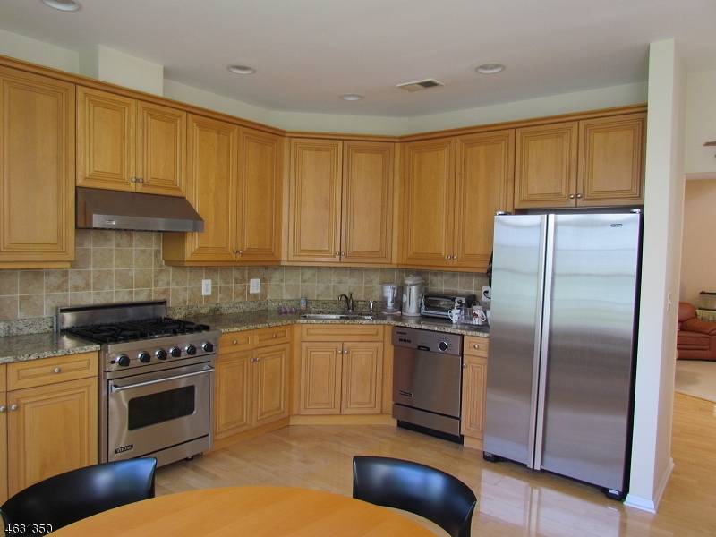 End unit, full privacy, sun filled Bristol model with south western exposure facing lush green.
