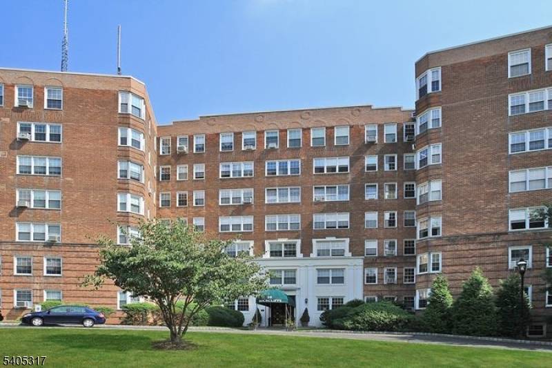 Spacious top floor co op apartment in elegant pre war building located on top of First Mountain in a park like setting.