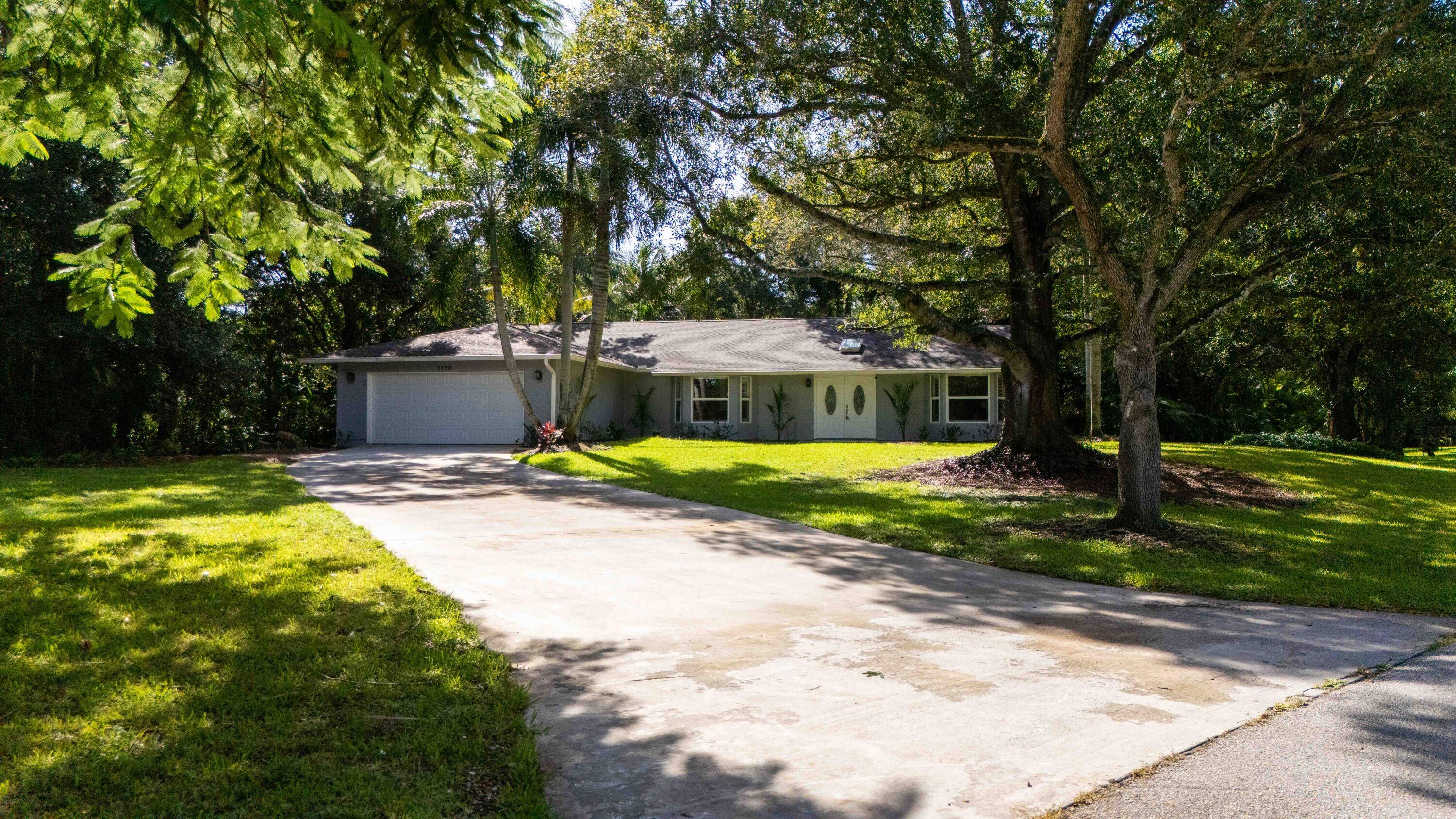 Welcome to this showstopping 3 bedroom, 2 bathroom, 2 car garage pool home in the highly desirable Coral Lakes community of Stuart.