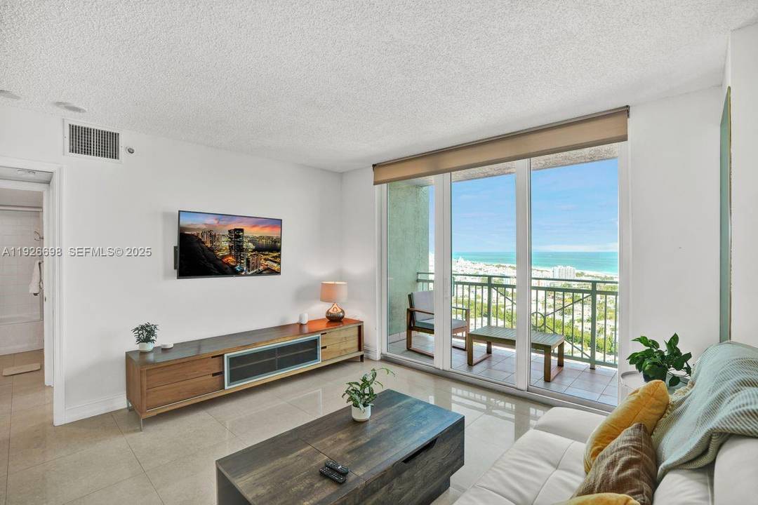 This lovely one bed, one bath, condo at The Yacht Club Portofino, features a spacious layout with abundant natural light flooding the rooms through the expansive windows.