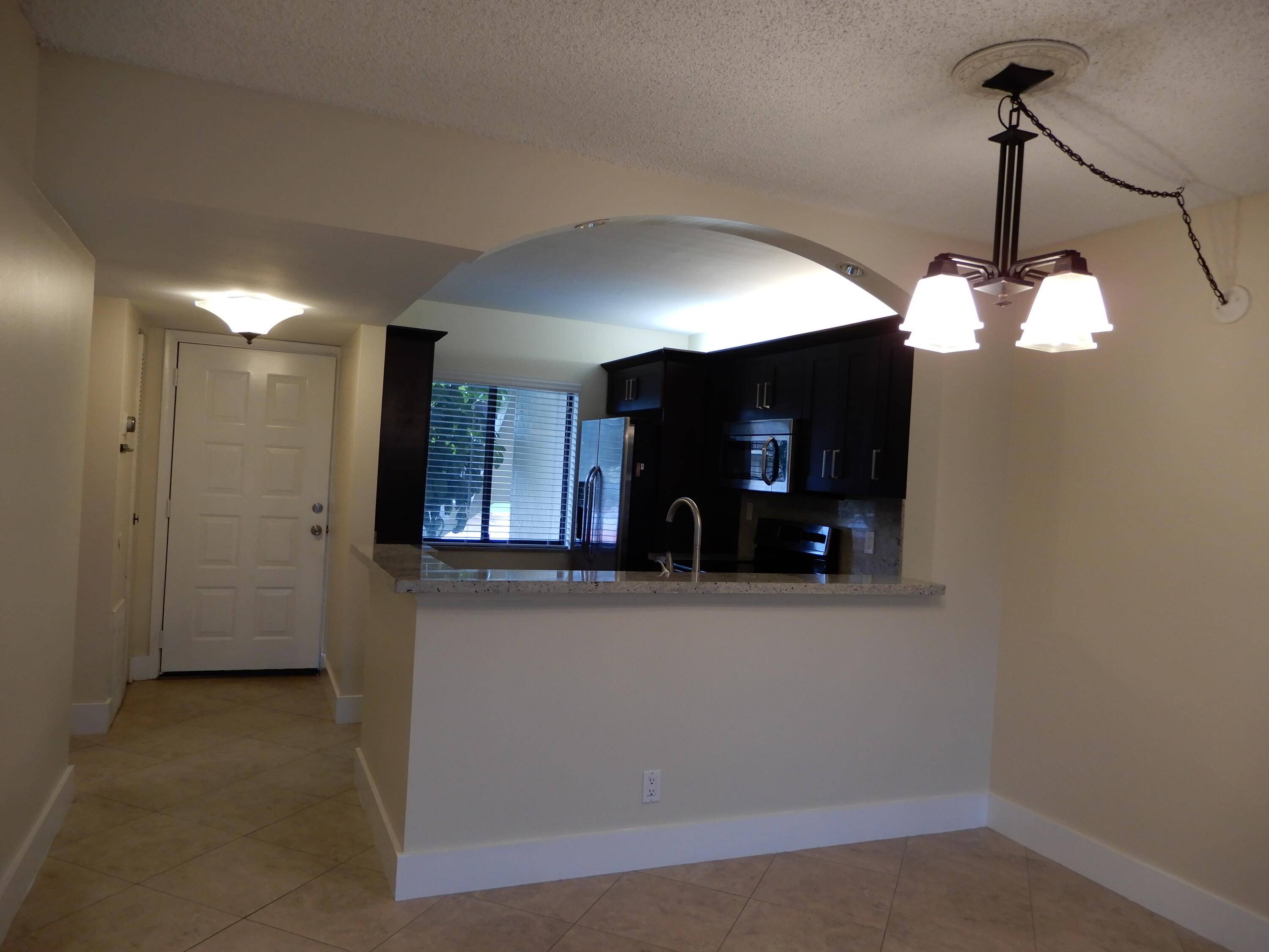 Updated cherry cabinets. Extra storage in kitchen.