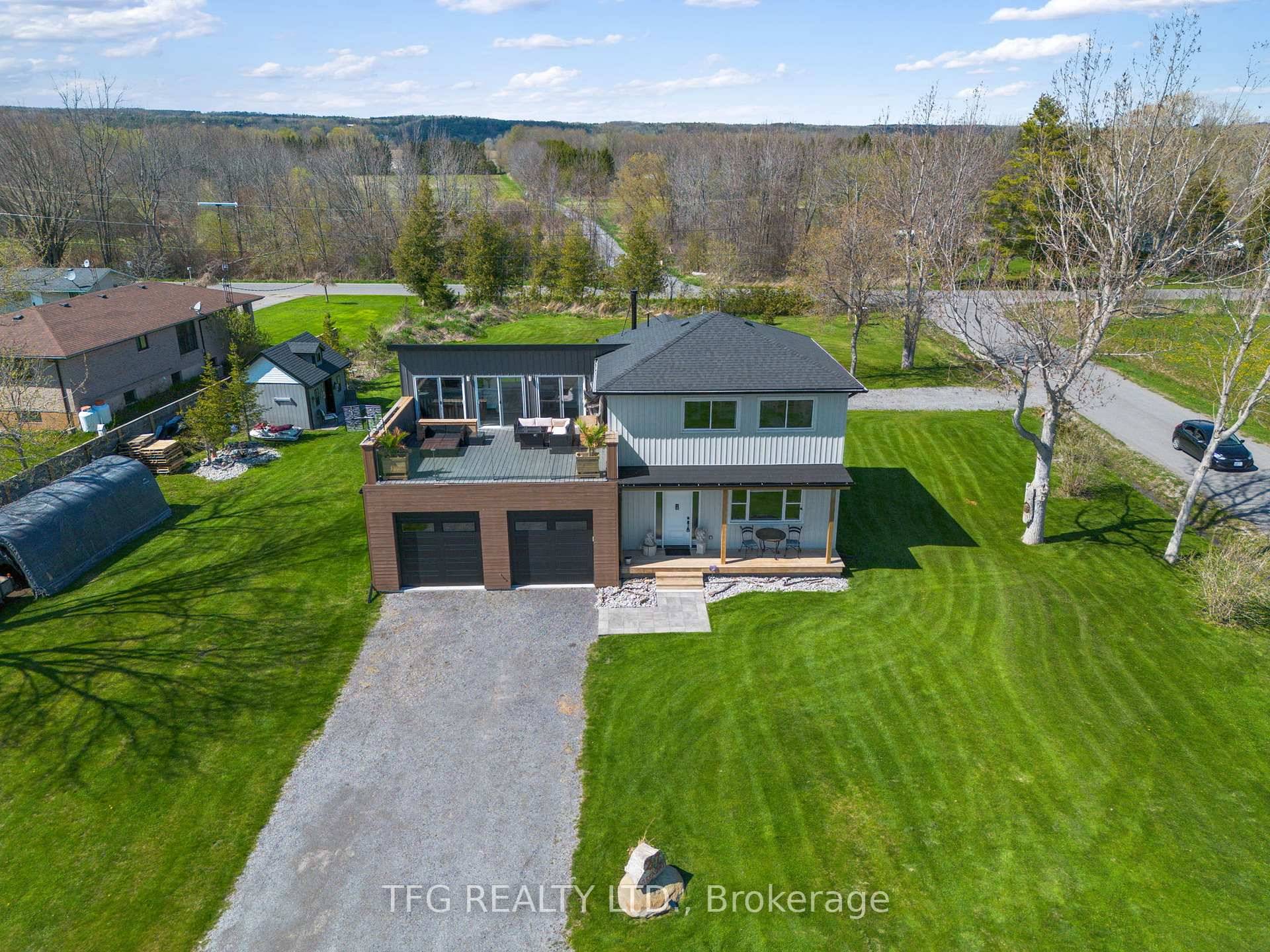 Newly renovated 2022 2024 custom home on over half an acre offers modern lakeside living with small town vibes.