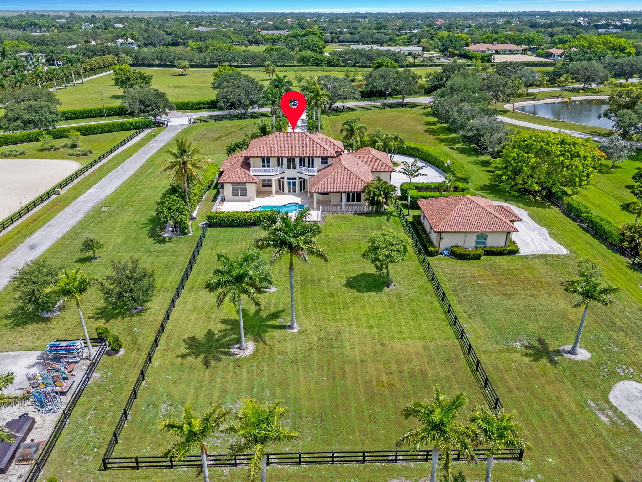 Nestled in the picturesque gated community of Palm Beach Point, this stunning estate epitomizes luxury living.