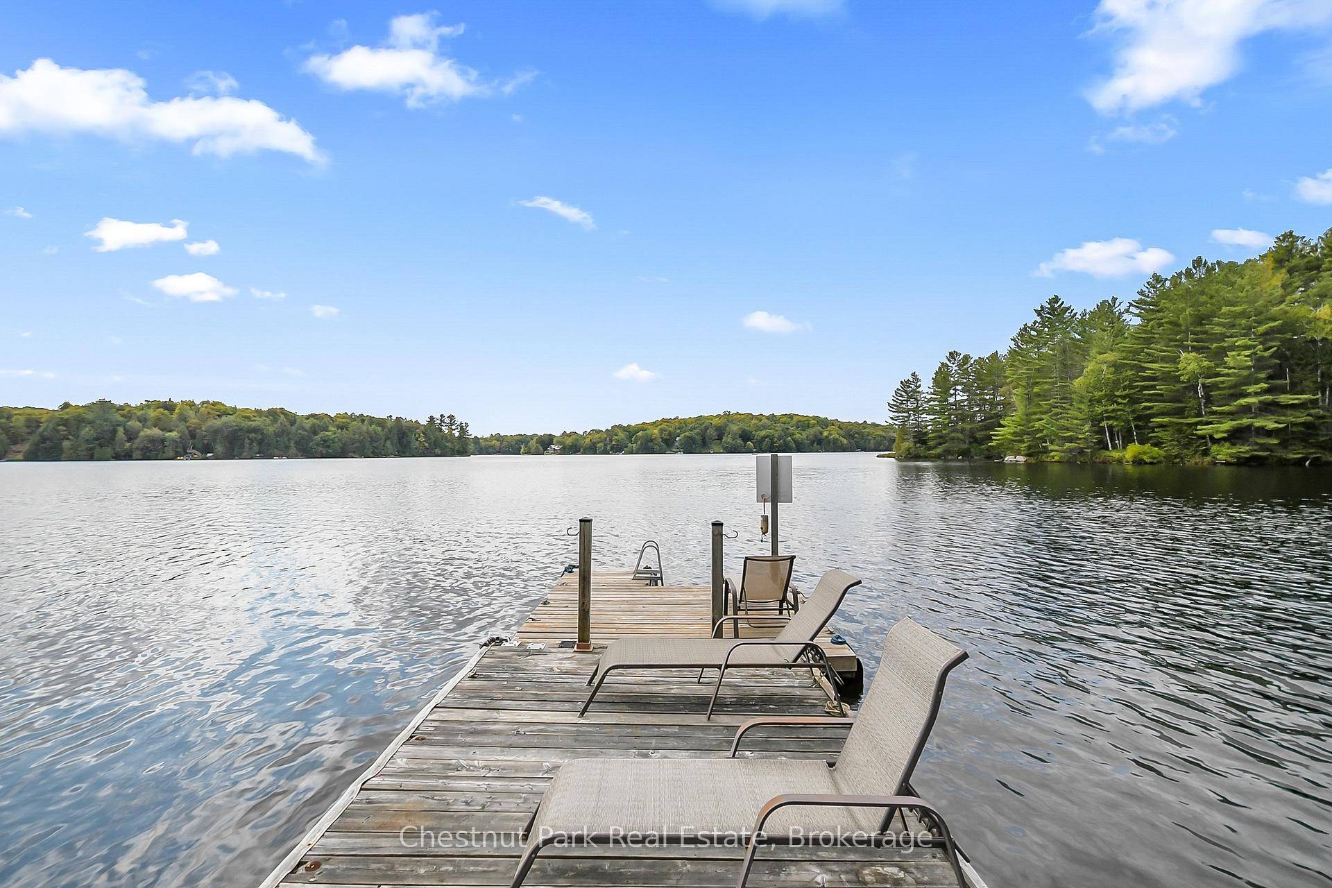 YEAR ROUND COTTAGE HOME on POPULAR BAY LAKE is tucked away from the Road with 110' of SOUTHWESTERN exposure to enjoy the summer sun on your dock all day long.