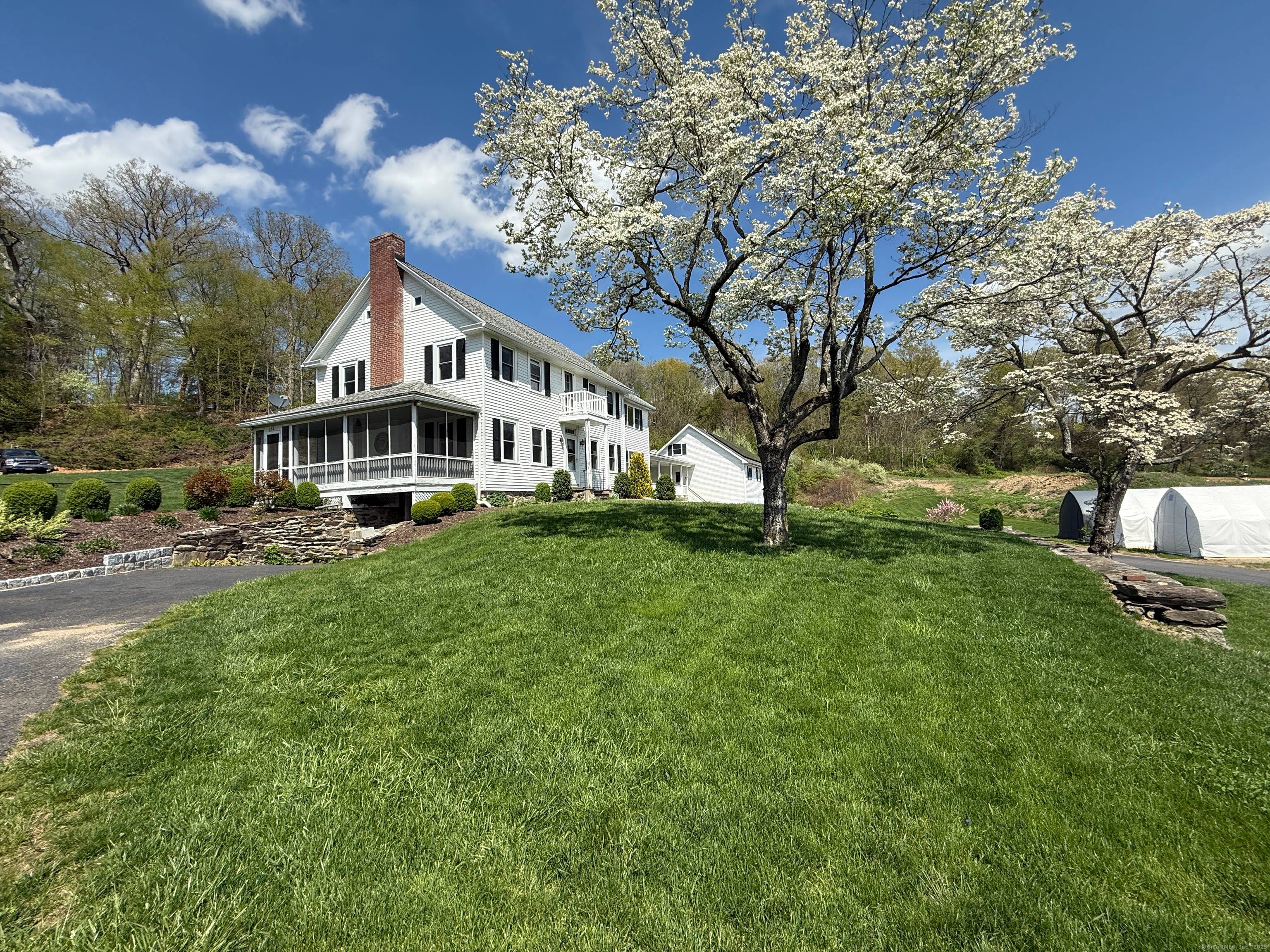 Charming country colonial home with stunning views of expansive farmland.
