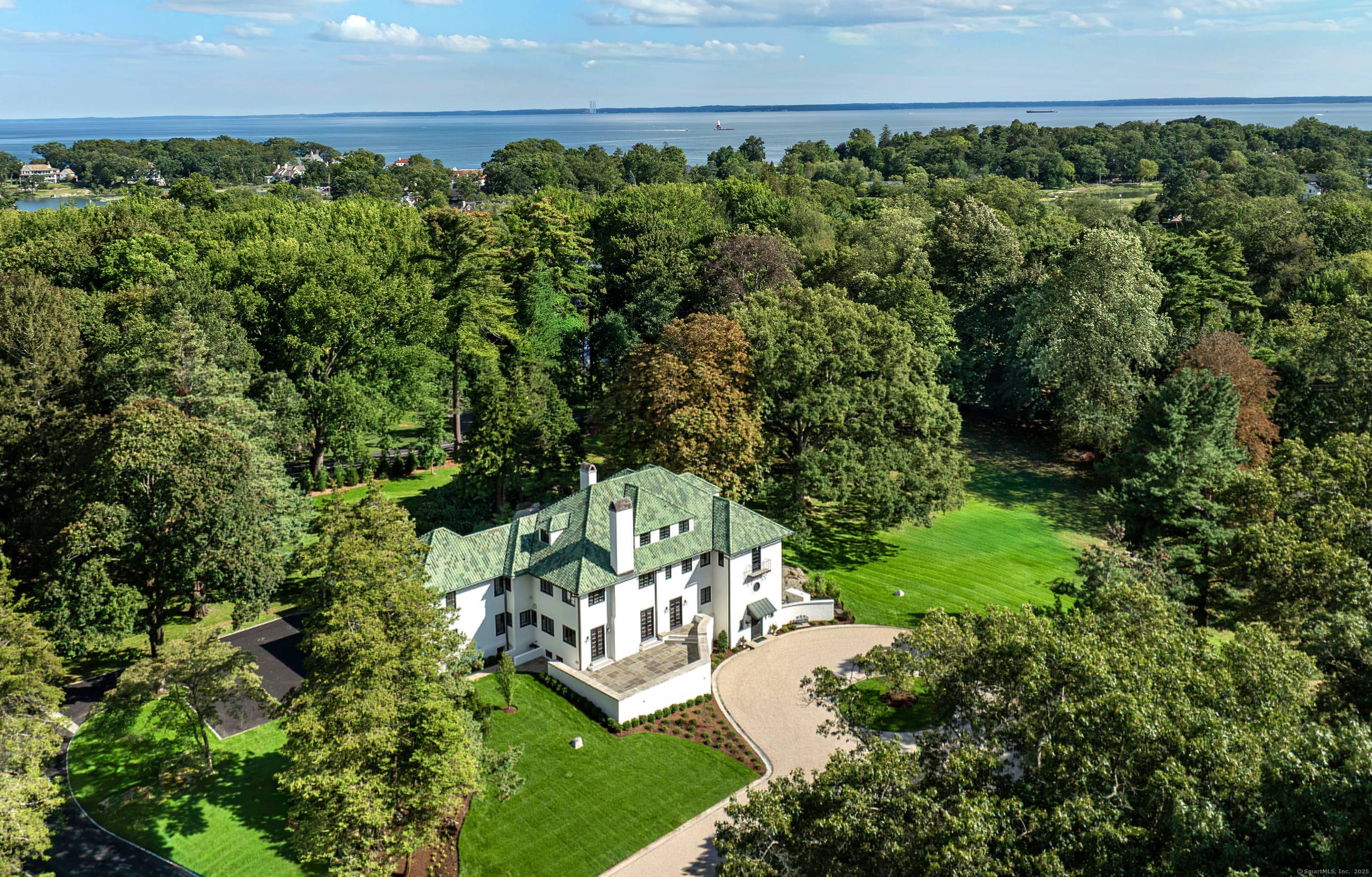This magnificent Round Meadows estate with a fantastic 9700 sf house on 5.