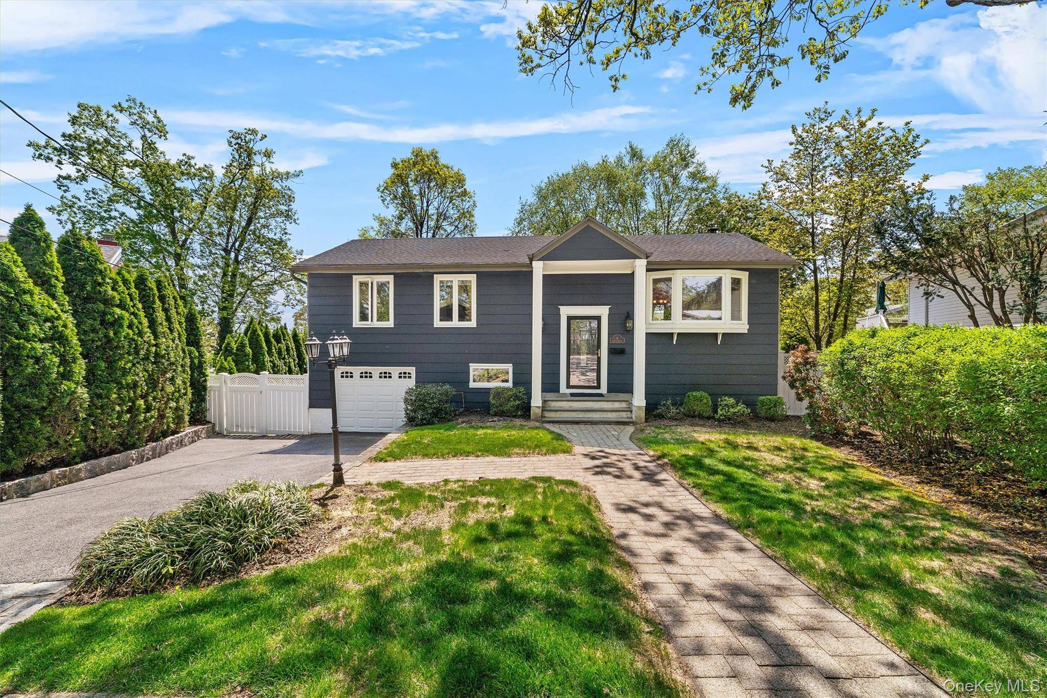 Welcome to this beautifully updated Raised Ranch, a perfect fit for first time buyers, growing families, or commuters.