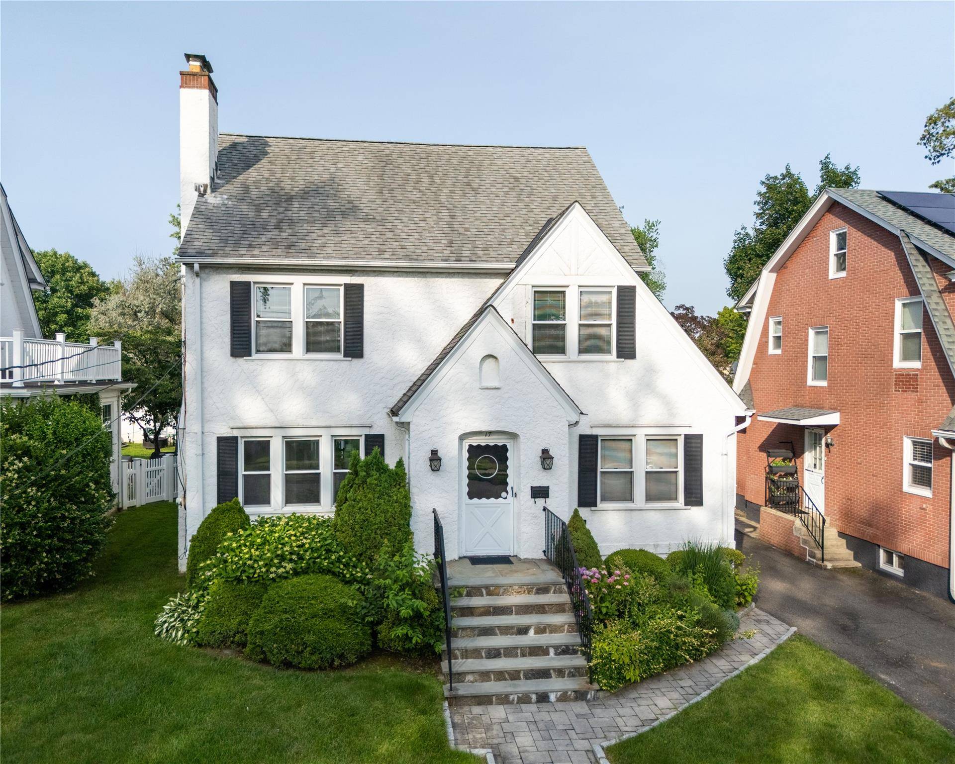 Colonial park area of Port Chester near Greenwich border this home sits on lush emerald green lawn with specimen plantings, private rear deck surrounded by green trees.