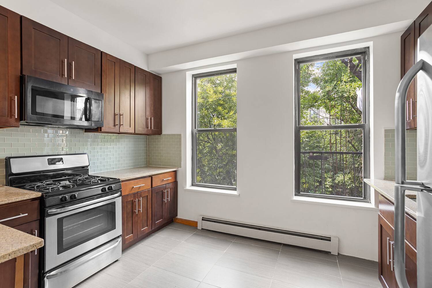 This freshly renovated gem features all new windows, two full brand new bathrooms, and a flexible layout use it as a true 3 bedroom or a spacious 2 bedroom office.