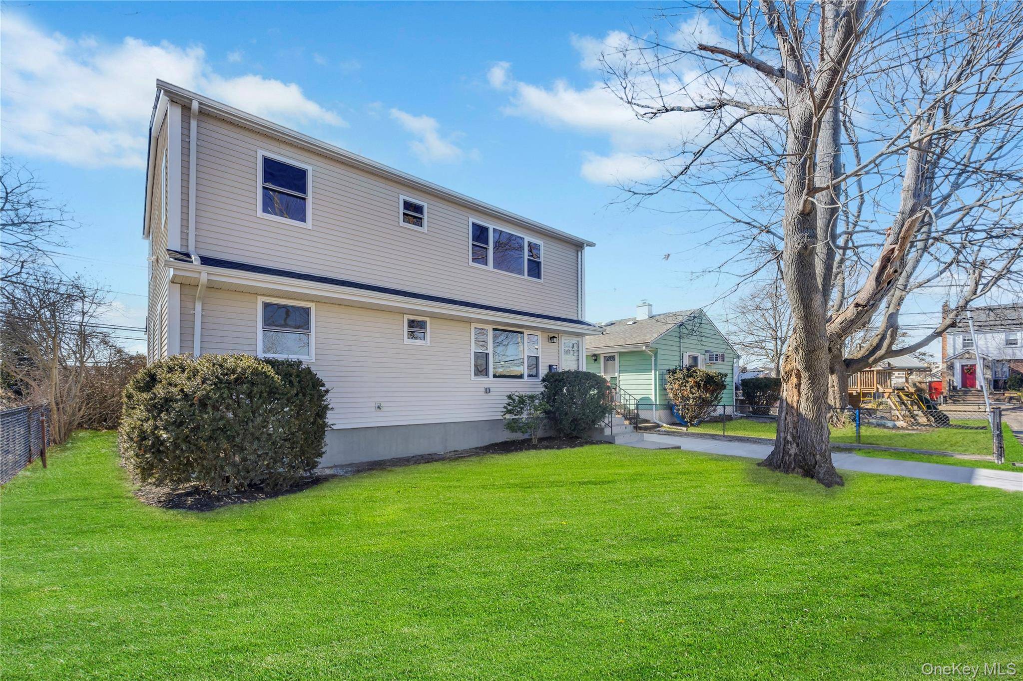 Beautifully Remodeled Expanded Ranch, Features Open Floor plan with Spacious Living Room and Gourmet Kitchen, 5 Bedrooms, 2 Newly Remodeled Full Bathrooms.