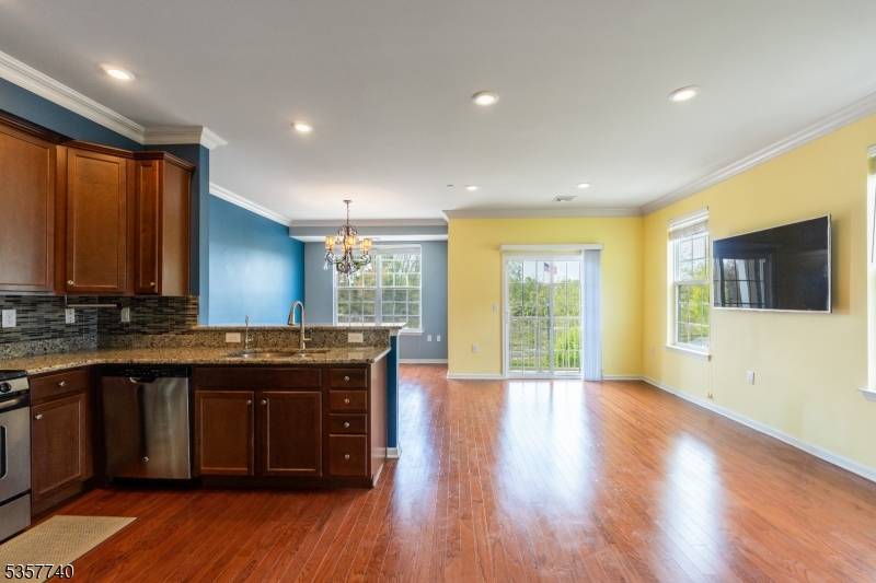 Welcome to 302 Waterview Court, a spacious and sun filled end unit townhouse nestled in the sought after community of Cedar Knolls.
