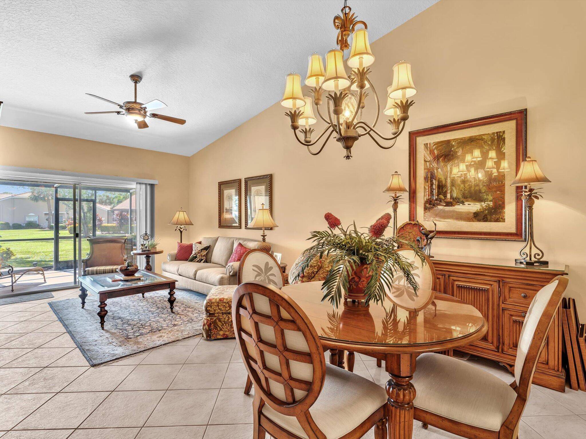 Lake view Milan model villa with 2 bedrooms, 2 baths, den, and screened roofed expanded patio.