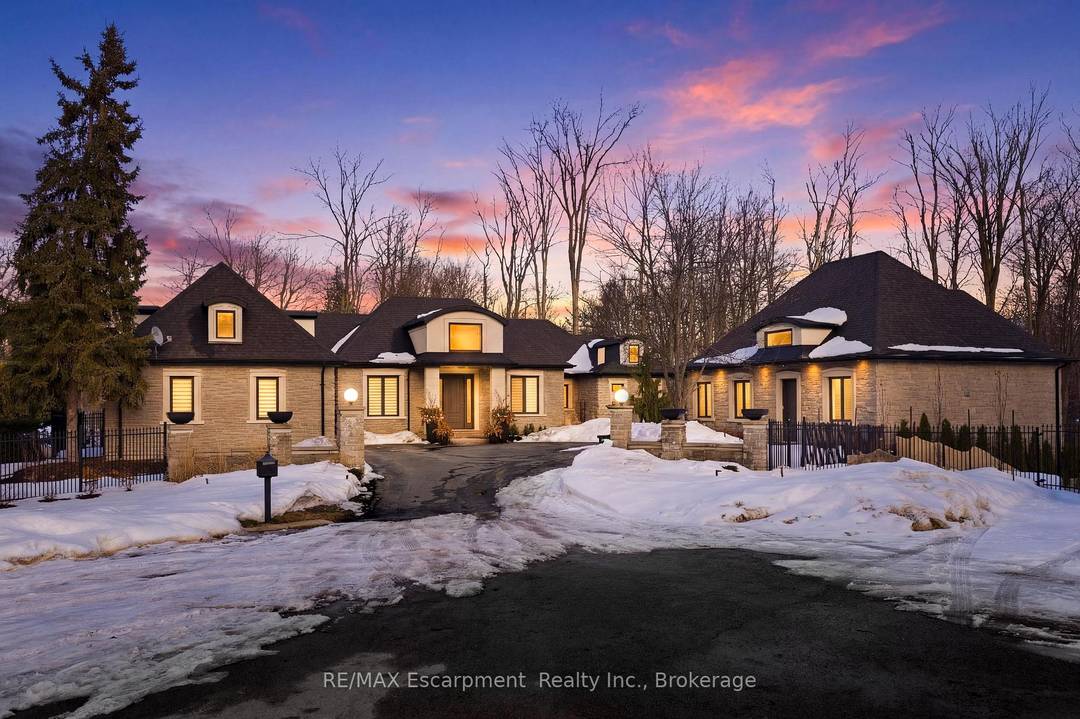Rare offering on 2 private acres in one of Burlington's most sought after estate communities.