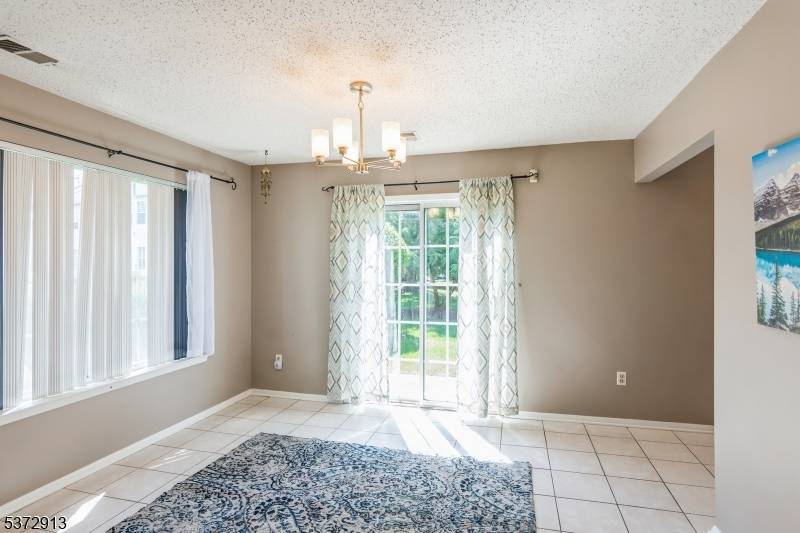 Step into this stunningly updated three level end unit offering 3 bedrooms and 3.