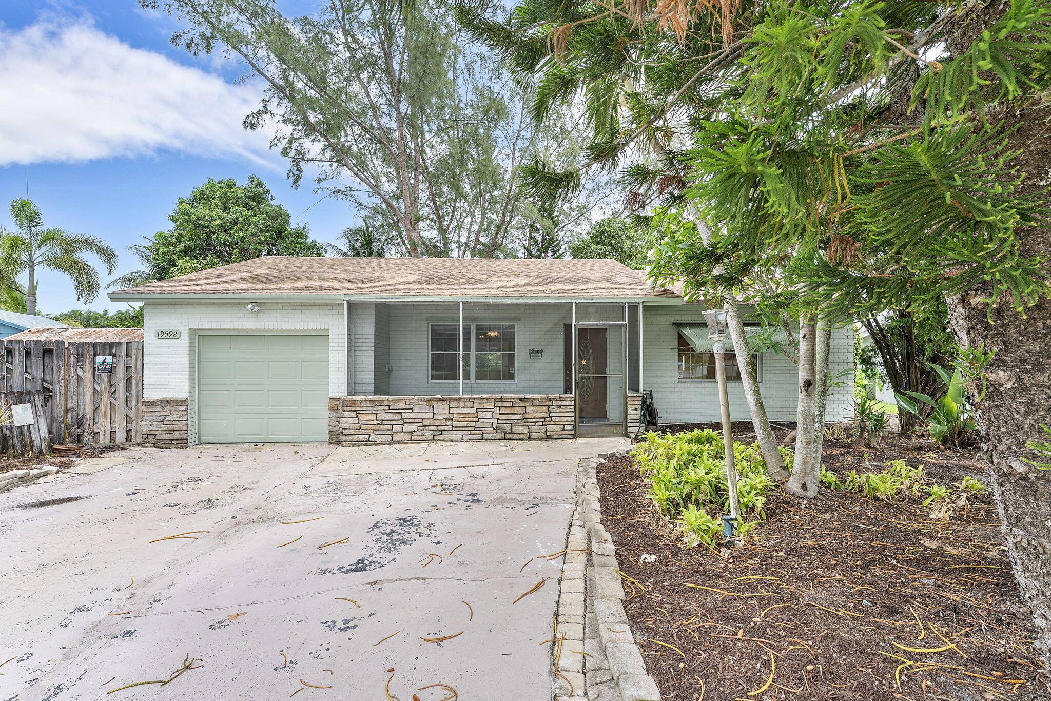 This 2 bedroom, 2 bathroom home is located on a waterfront lot in Boca Raton and offers good potential for buyers looking to customize.