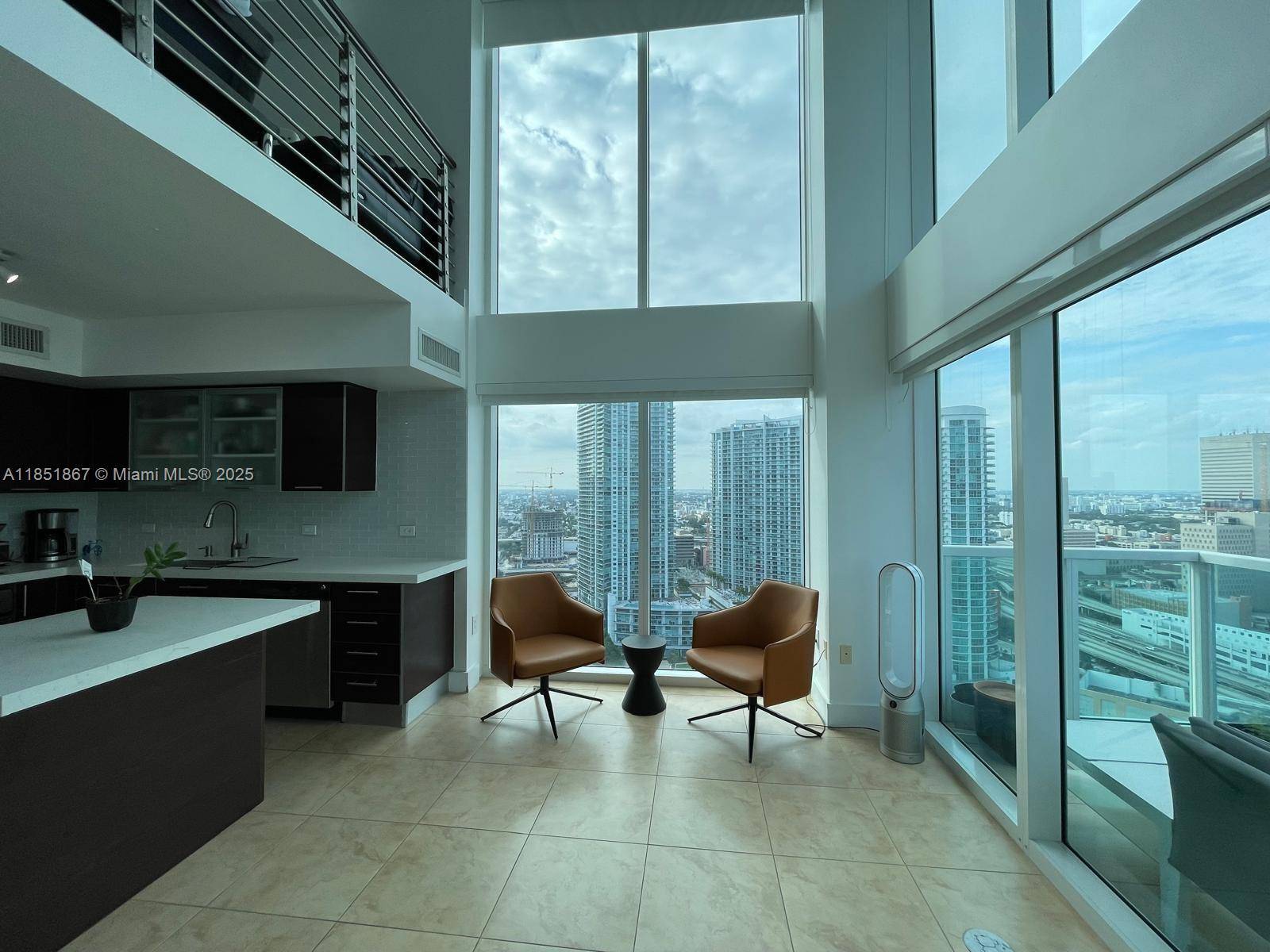 Newly remodeled corner unit with two oversized terraces facing west and water views to the east.