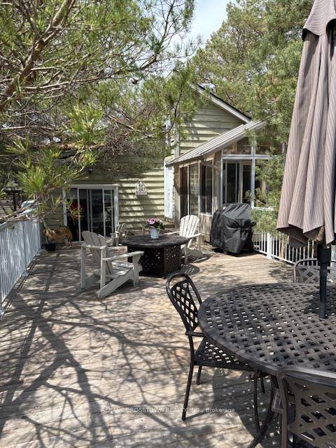 Welcome to this Wonderful Four Season Waterfront Bungalow Nestled in the Heart of Wasaga Beach.